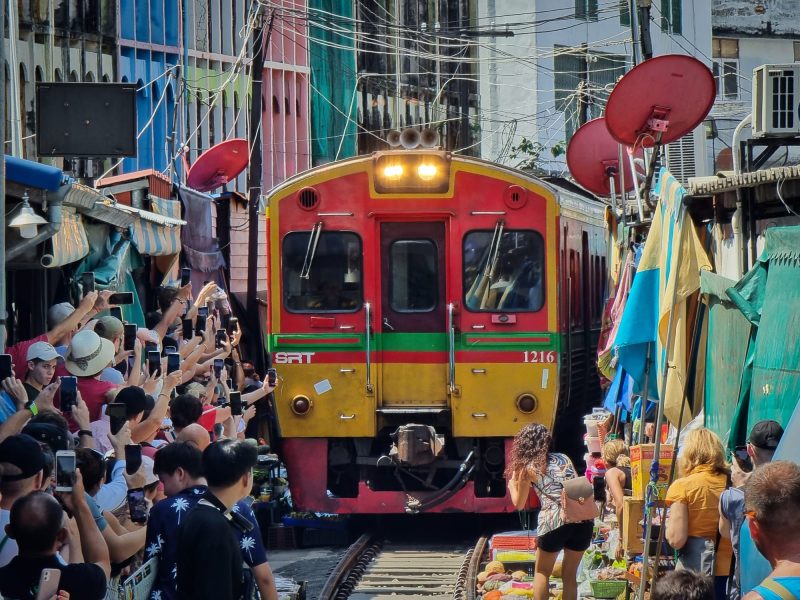 Maeklong Railway Market with retracting stalls
